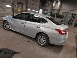 2019 Nissan Sentra S z VIN 3N1AB7AP7KY345072, wystawiony jako IAAI lot #41284957 z przebiegiem 104 084 mil mil oraz . Historia ofert i sprzedaży dostępna na DreamBid. Obrazek 3.