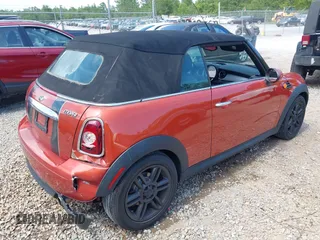 2011 MINI Convertible with VIN WMWZN3C57BTZ89303, listed as a IAAI auction lot 42352242 with 146,448 mi miles and . Bid and sale history available at DreamBid. Image 4.