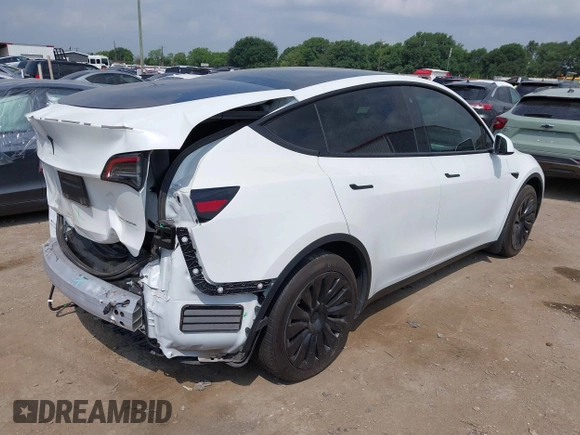 2023 Tesla Model Y Long Range with VIN 7SAYGAEEXPF776370, listed as a IAAI auction lot 42127512 with 27,120 mi miles and . Bid and sale history available at DreamBid. Image 4.