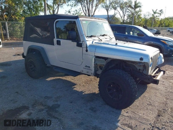 2005 Jeep Wrangler Unlimited with VIN 1J4FA44S65P335444, listed as a IAAI auction lot 41731093 with 143,918 mi miles. Bid and sale history available at carsss.com. Image 1.