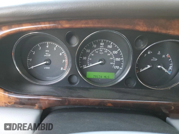 2004 Jaguar XJ with VIN SAJWA71C74SG20299, listed as a Copart auction lot 79469504 with 78,134 mi miles and Salvage Title. Bid and sale history available at carsss.com. Image 9.