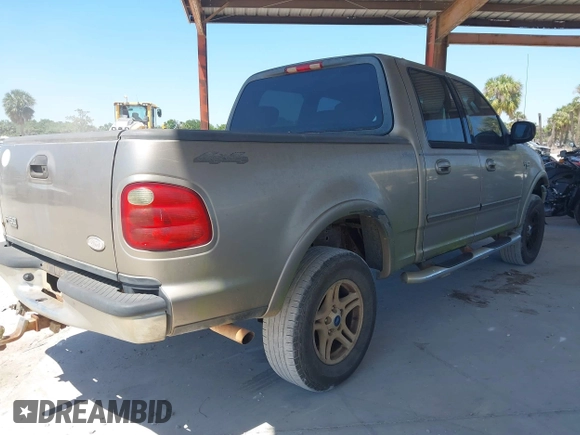 2002 Ford F-150 XLT with VIN 1FTRW08LX2KE43025, listed as a IAAI auction lot 42060641 with 123,507 mi miles. Bid and sale history available at carsss.com. Image 4.