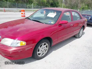 2000 Mazda 626 LX with VIN 1YVGF22C8Y5115891, listed as a IAAI auction lot 42121137 with 186,165 mi miles. Bid and sale history available at carsss.com. Image 2.