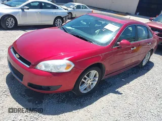 2013 Chevrolet Impala LTZ with VIN 2G1WC5E35D1175879, listed as a IAAI auction lot 42143602 with 156,385 mi miles and . Bid and sale history available at DreamBid. Image 2.