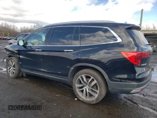 2017 Honda Pilot Touring with VIN 5FNYF6H90HB028112, listed as a Copart auction lot 52197645 with 218,944 mi miles and Salvage Title. Bid and sale history available at DreamBid. Image 2.