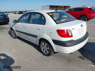 2009 Kia Rio SX with VIN KNADE223696518580, listed as a IAAI auction lot 41990650 with 1 mi miles. Bid and sale history available at carsss.com. Image 3.