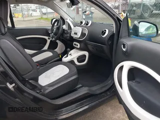 2016 Smart fortwo Passion z VIN WMEFJ5DA8GK059871, wystawiony jako IAAI lot #41624917 z przebiegiem 90 906 mil mil oraz . Historia ofert i sprzedaży dostępna na DreamBid. Obrazek 5.