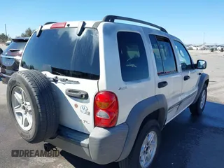 2002 Jeep Liberty Sport with VIN 1J8GL48KX2W153948, listed as a IAAI auction lot 41843882 with 180,677 mi miles. Bid and sale history available at carsss.com. Image 4.