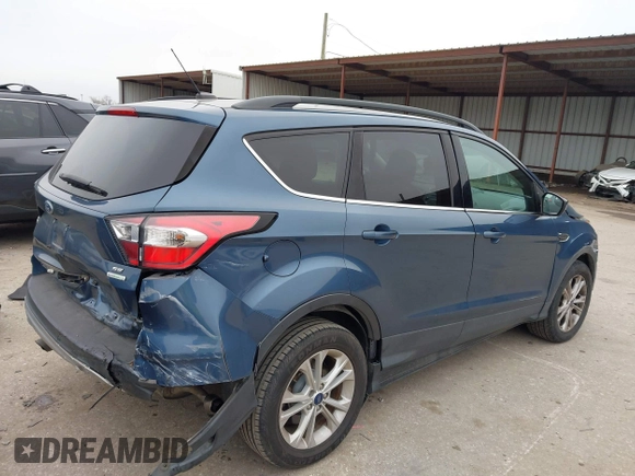 2018 Ford Escape SE with VIN 1FMCU0GD0JUC58115, listed as a IAAI auction lot 41578309 with 76,162 mi miles. Bid and sale history available at carsss.com. Image 4.