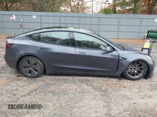 2022 Tesla Model 3 with VIN 5YJ3E1EA7NF339952, listed as a IAAI auction lot 38007332 with 10,726 mi miles. Bid and sale history available at carsss.com. Image 13.