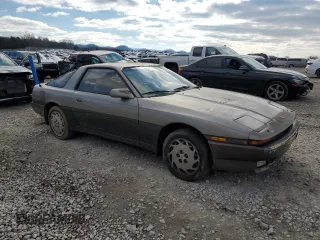 1986 Toyota Supra z VIN JT2MA70L3G0009411, wystawiony jako Copart lot #87545755 z przebiegiem 151 108 mil mil oraz Czysty tytuł • Clean title. Historia ofert i sprzedaży dostępna na DreamBid. Obrazek 4.
