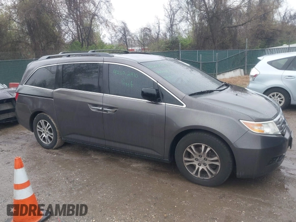 2012 Honda Odyssey EX-L with VIN 5FNRL5H6XCB057557, listed as a IAAI auction lot 42022410 with 174,286 mi miles and . Bid and sale history available at DreamBid. Image 13.