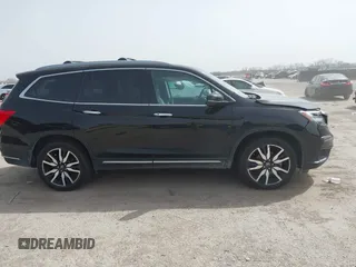 2020 Honda Pilot Touring 8-Passenger with VIN 5FNYF6H91LB003552, listed as a IAAI auction lot 41743685 with 76,725 mi miles and . Bid and sale history available at DreamBid. Image 13.