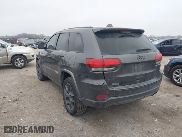 2021 Jeep Grand Cherokee 80th Anniversary z VIN 1C4RJFBGXMC621817, wystawiony jako IAAI lot #41519733 z przebiegiem 60 552 mil mil oraz . Historia ofert i sprzedaży dostępna na DreamBid. Obrazek 3.