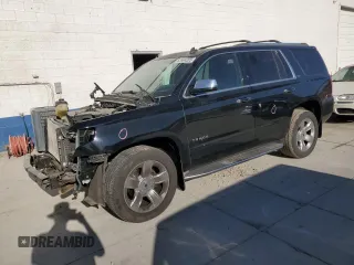 2015 Chevrolet Tahoe LTZ with VIN 1GNSKCKC5FR247148, listed as a Copart auction lot 62994285 with 133,885 mi miles and Salvage title. Bid and sale history available at DreamBid. Image 1.