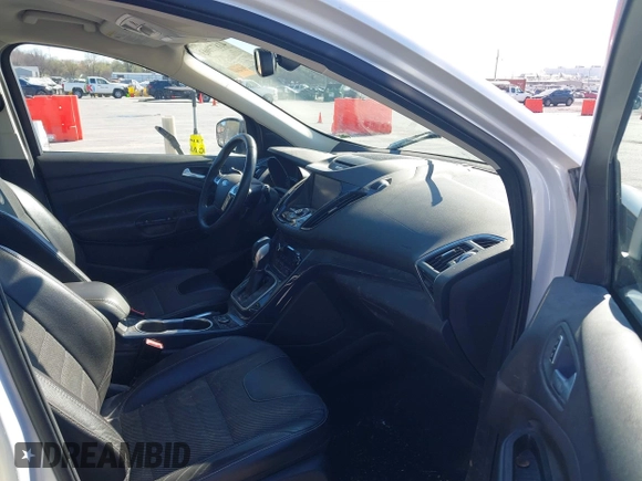 2013 Ford Escape Titanium with VIN 1FMCU0J96DUA71857, listed as a IAAI auction lot 41877003 with 118,864 mi miles and . Bid and sale history available at carsss.com. Image 5.