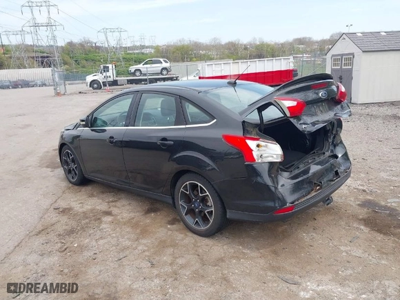 2012 Ford Focus Titanium with VIN 1FAHP3J2XCL369554, listed as a IAAI auction lot 42072931 with 95,474 mi miles. Bid and sale history available at carsss.com. Image 3.