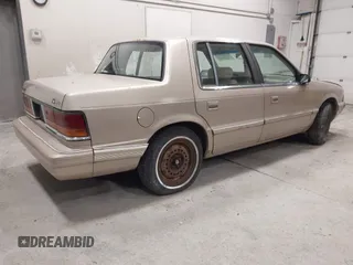 1991 Dodge Spirit z VIN 1B3XA46KXMF519542, wystawiony jako IAAI lot #42278204 z przebiegiem 134 919 mil mil oraz . Historia ofert i sprzedaży dostępna na DreamBid. Obrazek 4.