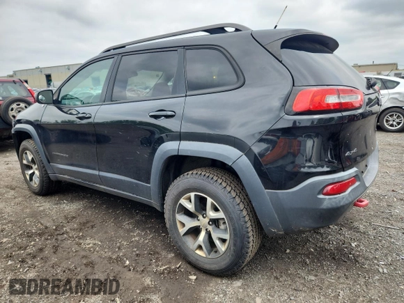 2014 Jeep Cherokee Trailhawk with VIN 1C4PJMBS3EW127928, listed as a Copart auction lot 63825865 with 172,712 mi miles and Salvage title. Bid and sale history available at DreamBid. Image 2.