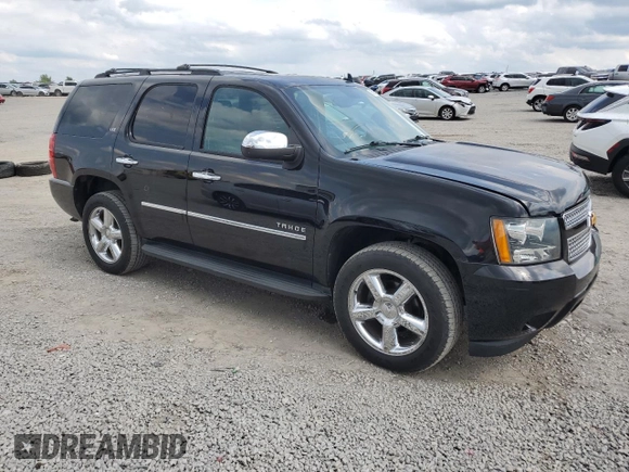 2014 Chevrolet Tahoe LTZ with VIN 1GNSKCE0XER228028, listed as a Copart auction lot 56971135 with 155,285 mi miles and Salvage title. Bid and sale history available at DreamBid. Image 4.