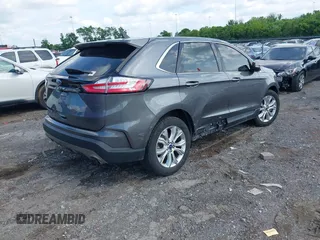 2021 Ford Edge Titanium z VIN 2FMPK3K9XMBA21766, wystawiony jako IAAI lot #42187940 z przebiegiem 79 732 mil mil oraz . Historia ofert i sprzedaży dostępna na DreamBid. Obrazek 4.
