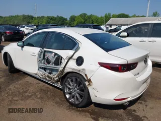 2022 Mazda 3 Carbon Edition with VIN 3MZBPACL0NM318573, listed as a IAAI auction lot 42403393 with 8,762 mi miles and . Bid and sale history available at DreamBid. Image 6.