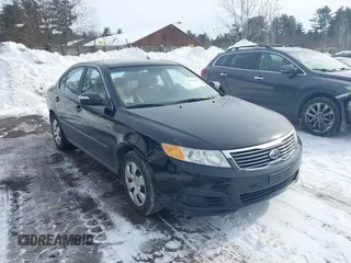 2010 Kia Optima LX with VIN KNAGG4A88A5395682, listed as a IAAI auction lot 41529113 with 142,089 mi miles. Bid and sale history available at carsss.com. Image 1.