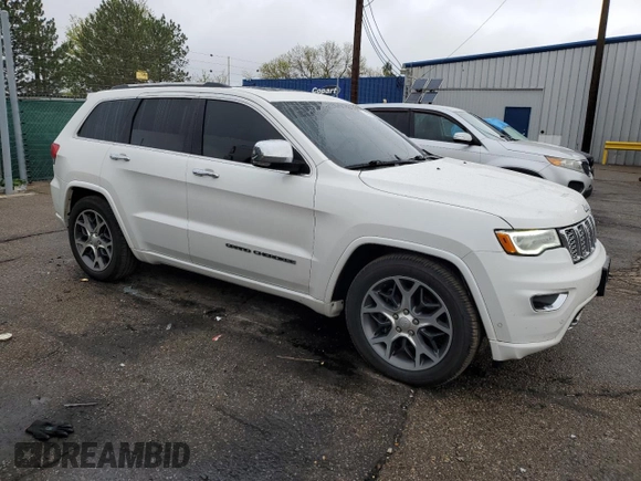 2019 Jeep Grand Cherokee Overland with VIN 1C4RJFCT7KC640527, listed as a Copart auction lot 54276725 with 282,202 mi miles and Salvage title. Bid and sale history available at DreamBid. Image 4.