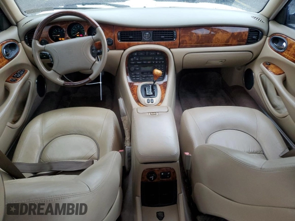 1999 Jaguar XJ with VIN SAJKD6041XC876928, listed as a Copart auction lot 60038405 with 63,917 mi miles and Clean title. Bid and sale history available at DreamBid. Image 8.