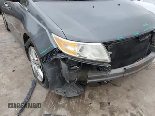 2012 Honda Odyssey Touring with VIN 5FNRL5H96CB138548, listed as a IAAI auction lot 41471856 with 186,284 mi miles and . Bid and sale history available at DreamBid. Image 6.
