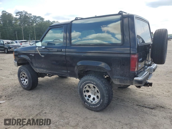 1990 Ford Bronco with VIN 1FMCU14T9LUA15536, listed as a Copart auction lot 54391815 with 319,124 mi miles and Salvage title. Bid and sale history available at DreamBid. Image 2.