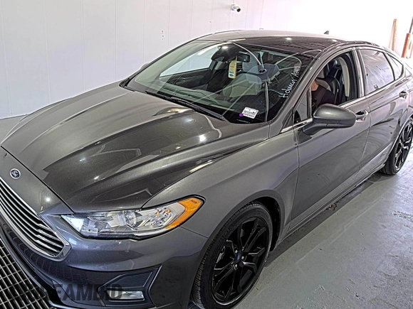 2020 Ford Fusion SE z VIN 3FA6P0HD6LR189762, wystawiony jako IAAI lot #42780149 z przebiegiem 51 099 mil mil oraz . Historia ofert i sprzedaży dostępna na DreamBid. Obrazek 4.