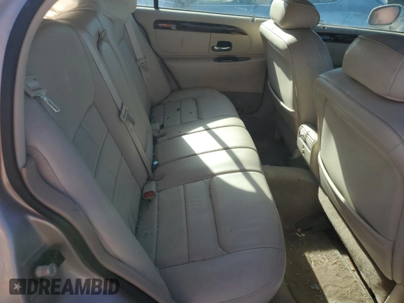 1999 Lincoln Town Car Signature z VIN 1LNHM82W7XY626305, wystawiony jako Copart lot #58009475 z przebiegiem Nie podano mil oraz Szkoda całkowita • Salvage title. Historia ofert i sprzedaży dostępna na DreamBid. Obrazek 10.
