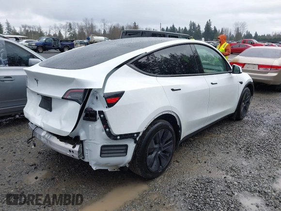 2025 Tesla Model Y Long Range with VIN 7SAYGDEDXSF248734, listed as a IAAI auction lot 41719195 with 5,876 mi miles and . Bid and sale history available at DreamBid. Image 4.