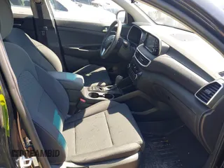 2019 Hyundai Tucson Value with VIN KM8J3CA46KU935335, listed as a IAAI auction lot 42296162 with 65,099 mi miles and . Bid and sale history available at DreamBid. Image 5.