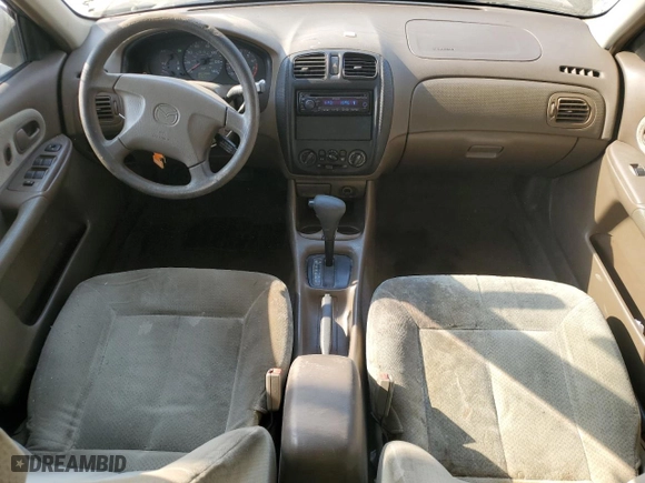 1999 Mazda Protege DX with VIN JM1BJ2223X0137153, listed as a Copart auction lot 87899735 with 154,209 mi miles and Salvage Title. Bid and sale history available at carsss.com. Image 8.