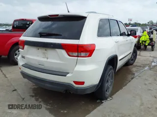 2012 Jeep Grand Cherokee Laredo with VIN 1C4RJFAG8CC124877, listed as a IAAI auction lot 41940603 with 254,356 mi miles. Bid and sale history available at carsss.com. Image 4.