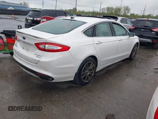 2016 Ford Fusion Titanium with VIN 3FA6P0K98GR369433, listed as a IAAI auction lot 42214785 with 64,918 mi miles and . Bid and sale history available at DreamBid. Image 4.