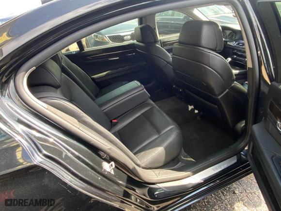 2012 BMW 7 Series 740Li with VIN WBAKB4C55CC576166, listed as a Copart auction lot 52448115 with 154,949 mi miles and Clean Title. Bid and sale history available at carsss.com. Image 6.