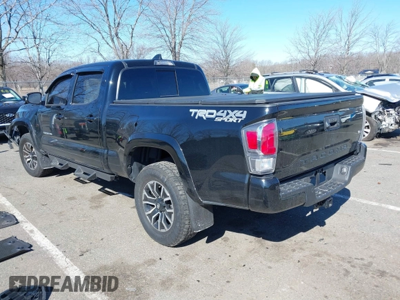 2021 Toyota Tacoma 4WD SR5 with VIN 3TMDZ5BN4MM117564, listed as a IAAI auction lot 41629220 with 77,063 mi miles. Bid and sale history available at carsss.com. Image 3.