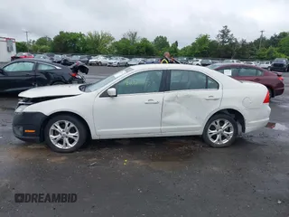 2012 Ford Fusion SE z VIN 3FAHP0HA4CR261668, wystawiony jako IAAI lot #42318115 z przebiegiem 81 923 mil mil oraz . Historia ofert i sprzedaży dostępna na DreamBid. Obrazek 14.