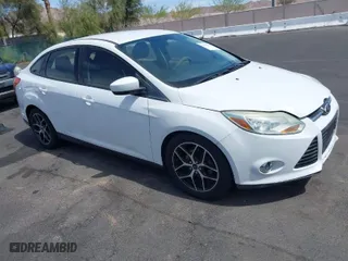 2012 Ford Focus SE with VIN 1FAHP3F24CL462319, listed as a IAAI auction lot 41981509 with 124,831 mi miles. Bid and sale history available at carsss.com. Image 1.