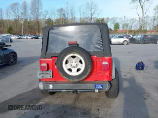 2003 Jeep Wrangler Sport with VIN 1J4FA49S13P320159, listed as a IAAI auction lot 41935699 with 212,355 mi miles. Bid and sale history available at carsss.com. Image 16.