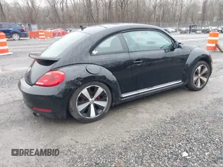 2012 Volkswagen Beetle 2.0T Turbo with VIN 3VWV67ATXCM663788, listed as a IAAI auction lot 41111055 with 152,454 mi miles. Bid and sale history available at carsss.com. Image 4.