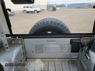 2003 Jeep Wrangler Sport z VIN 1J4FA49S93P306817, wystawiony jako Copart lot #60136385 z przebiegiem 217 208 mil mil oraz Czysty tytuł • Clean title. Historia ofert i sprzedaży dostępna na DreamBid. Obrazek 10.
