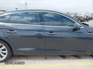 2018 Audi A5 Sportback Premium z VIN WAUANCF5XJA022221, wystawiony jako IAAI lot #42041410 z przebiegiem 94 851 mil mil oraz . Historia ofert i sprzedaży dostępna na DreamBid. Obrazek 13.
