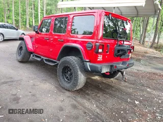 2018 Jeep Wrangler Unlimited Rubicon with VIN 1C4HJXFG3JW273266, listed as a IAAI auction lot 42093919 with 90,700 mi miles and . Bid and sale history available at DreamBid. Image 3.