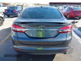 2018 Ford Fusion SE z VIN 3FA6P0H70JR191384, wystawiony jako IAAI lot #41340319 z przebiegiem 89 581 mil mil oraz . Historia ofert i sprzedaży dostępna na DreamBid. Obrazek 16.