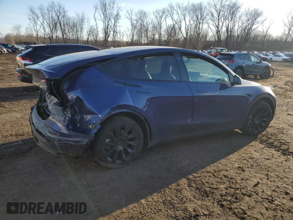 2021 Tesla Model Y Long Range with VIN 5YJYGAEE2MF262571, listed as a Copart auction lot 47309485 with 57,431 mi miles and Salvage Title. Bid and sale history available at carsss.com. Image 3.