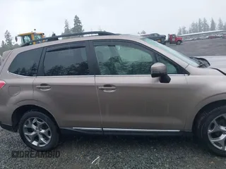 2015 Subaru Forester Touring with VIN JF2SJAUC1FH457069, listed as a IAAI auction lot 42293542 with 71,689 mi miles and . Bid and sale history available at DreamBid. Image 13.